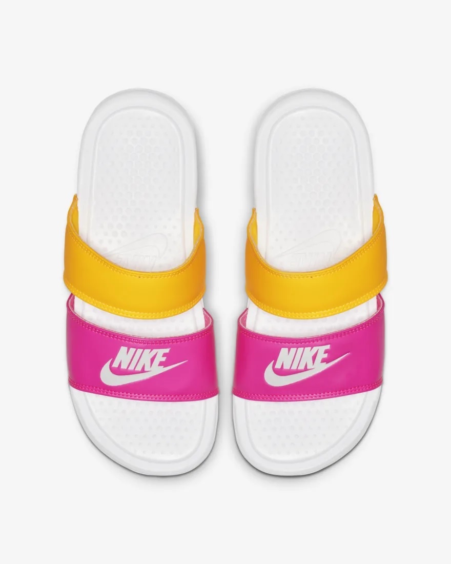 pink and yellow nike slides